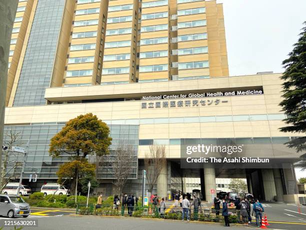 Media members gather at the National Center for Global Health and Medicine where Ken Shimura was hospitalized for COVID-19 infection on March 30,...
