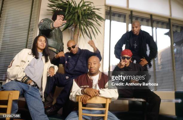 Portrait of American businessman Russell Simmons , New York, New York, 1990s. With him are, from left, an unidentified woman, film producer Nelson...