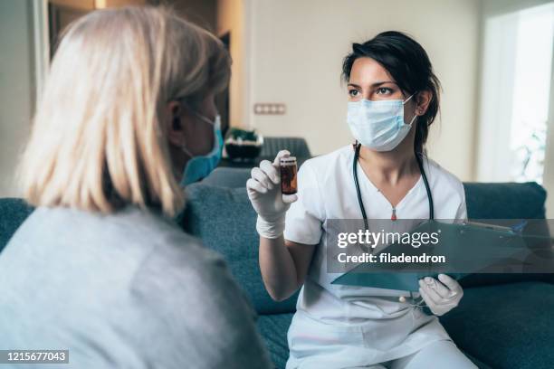 doctor's home visiting during the quarantine - bulgaria coronavirus stock pictures, royalty-free photos & images