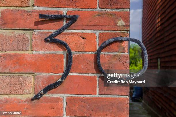 close up number 30 on the wall - countdown 100 stock pictures, royalty-free photos & images