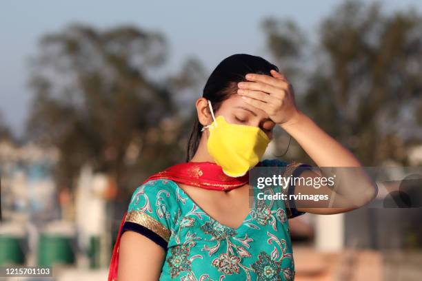 depressed women against lockdown and covid-19, new delhi, india - delhi lockdown stock pictures, royalty-free photos & images