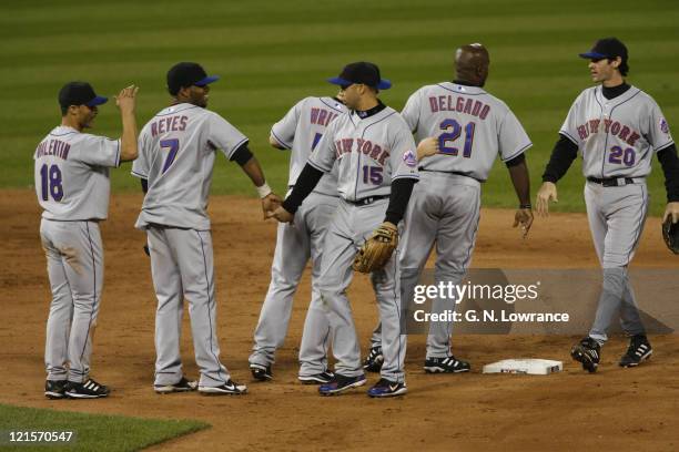 Carlos Beltran is congratulated by Jose Reyes following game 4 of the NLCS between the New York Mets and St. Louis Cardinals at Busch Stadium in St....