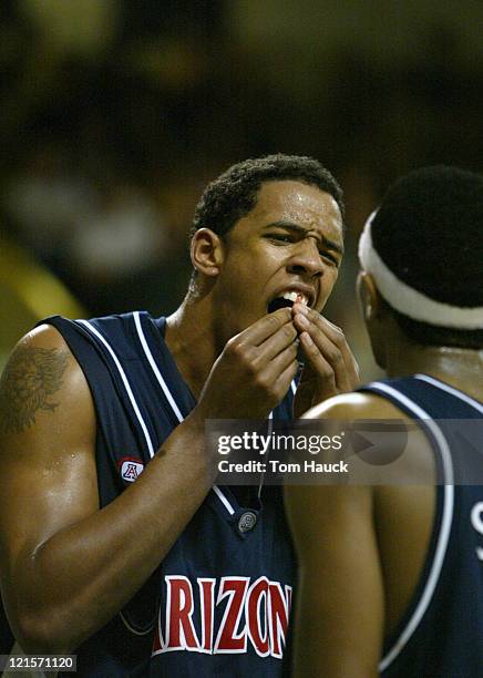 Channing Frye of the Arizona Wildcats reacts to loosing a tooth.The Arizona Wildcats defeat the Oregon Ducks 100-87 at McArthur Court in Eugene,...