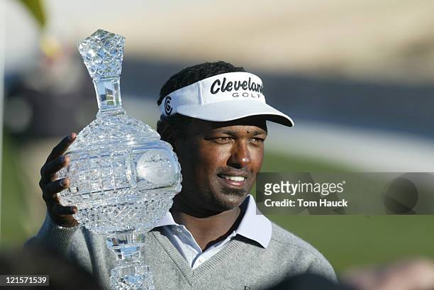 Vijay Signh holds up the trophy on the 18th green after winning 2004 AT&T Pebble Beach National Pro-AM the Pebble Beach Golf Links during the final...