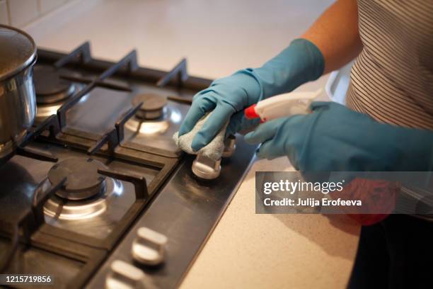 wiping down surfaces at house, covid-19 - camping stove stock pictures, royalty-free photos & images