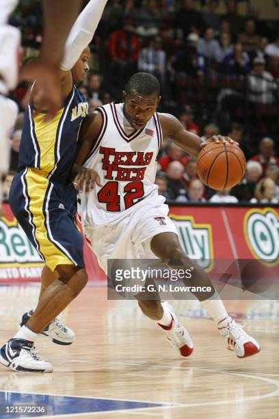 Charlie Burgess of Texas Tech drives the lane during semi-final action between Texas Tech and Marquette at the annual CBE Classic at Municipal...