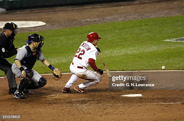 David Eckstein falls down after an attempted squeeze play during game 5 action of the NLCS between the New York Mets and St. Louis Cardinals at Busch...