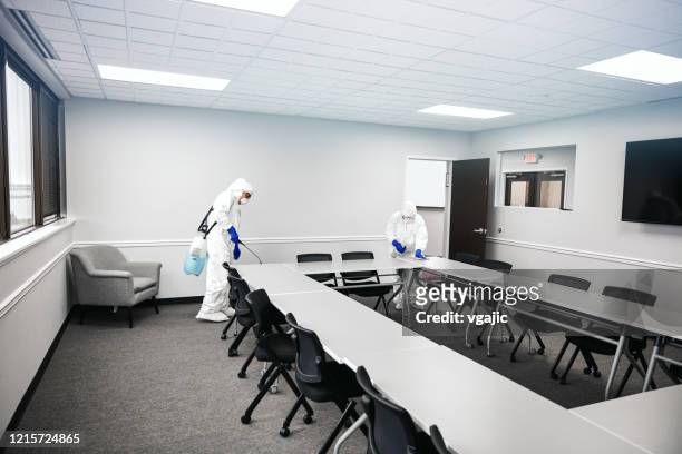 cleaning and disinfecting office - covid 19 cleaning stock pictures, royalty-free photos & images