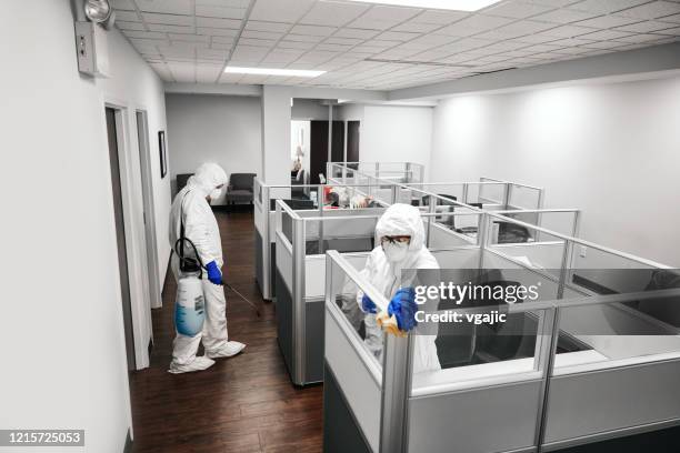 cleaning and disinfecting office - cleaning workstation stock pictures, royalty-free photos & images