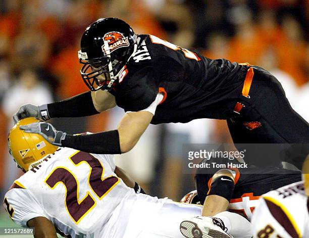 Hakim Hill of Arizona State is tackled by Phil Ghilarducci of Oregon State at Reiser Stadium in Corvallis, Oregon. Oregon State beat Arizona State...