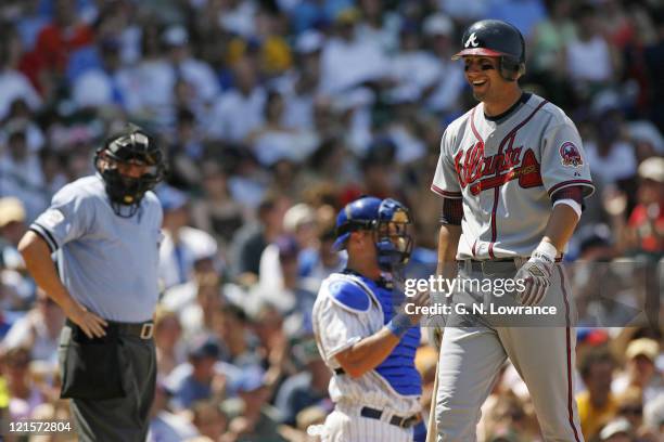 Jeff Francoeur of the Braves smiles sarcastically after getting called out looking on strike 3 by umpire Jerry Crawford during action between the...