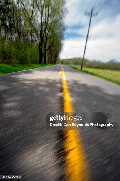 low angle view of road and meadow - atlanta georgia country stock pictures, royalty-free photos & images