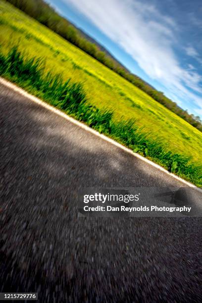 low angle view of road and meadow - atlanta georgia country stock pictures, royalty-free photos & images