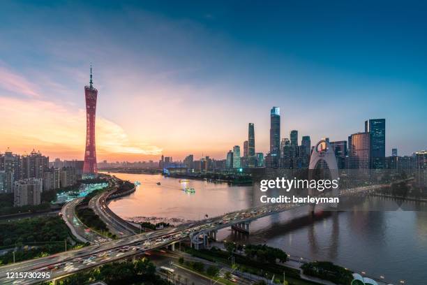 sunset of the city skyline/guangzhou,china - guangzhou stock pictures, royalty-free photos & images