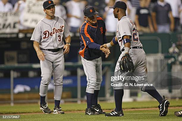 Detroit manager Jim Leyland congratulates Craig Monroe following a win over the Kansas City Royals at Kauffman Stadium in Kansas City, Missouri on...