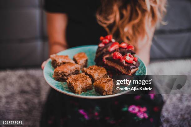 do you want chocolate strawberry cake, baklava or kanafeh - ramadan giving stockfoto's en -beelden