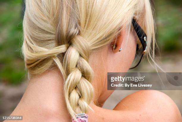 blonde plaited hair - frau zopf hinten stock-fotos und bilder