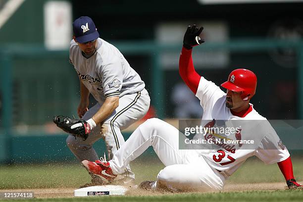 Cardinals pitcher Jeff Suppan slides in with a double during a game between the Milwaukee Brewers and St. Louis Cardinals at Busch Stadium in St....