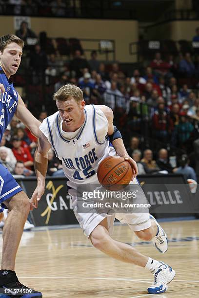 Nick Welch of Air Force drives the lane during semi-final action between Air Force and Duke at the annual CBE Classic at Municipal Auditorium in...
