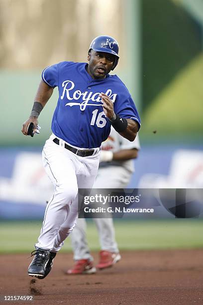 Reggie Sanders of the Royals runs towards third base during action between the St. Louis Cardinals and Kansas City Royals at Kauffman Stadium in...