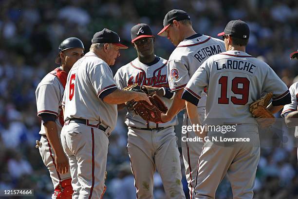 Braves manager Bobby Cox hands the ball to relief pitcher Chris Reitsma during action between the Atlanta Braves and Chicago Cubs at Wrigley Field in...