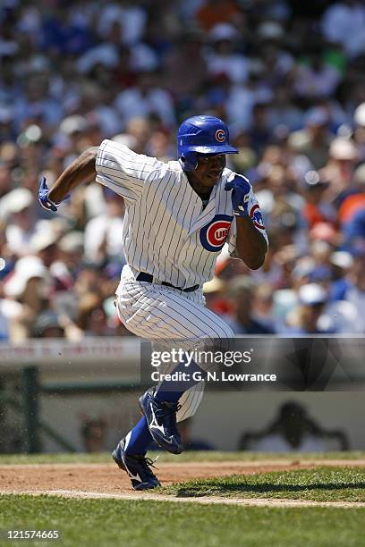 Juan Pierre of the Cubs heads to first base during action between the Atlanta Braves and Chicago Cubs at Wrigley Field in Chicago, Illinios on May...