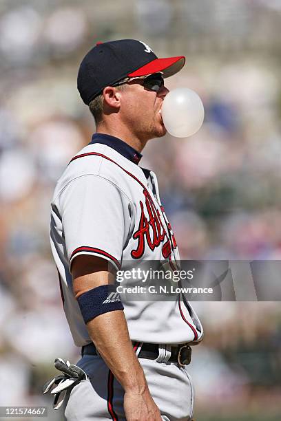 Chipper Jones of the Braves blows a bubble during action between the Atlanta Braves and Chicago Cubs at Wrigley Field in Chicago, Illinois on May 28,...