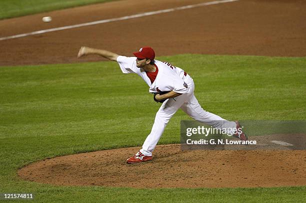 Cardinal reliever Adam Wainwright throws a pitch in the 9th inning during game 5 action of the NLCS between the New York Mets and St. Louis Cardinals...