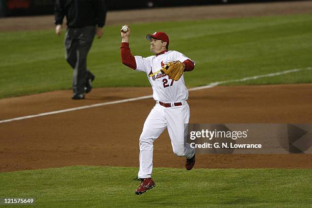 Scott Rolen of the Cardinals makes a bare-handed grab during game 3 of the NLCS between the New York Mets and St. Louis Cardinals at Busch Stadium in...