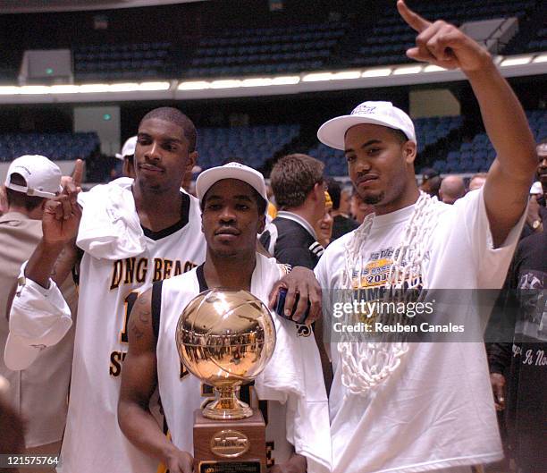 Guard Kevin Houston, forwards Sterling Byrd and Louis Darby of the Long Beach State 49ers celebrate after a 94 to 83 win over the Cal Poly Mustangs...