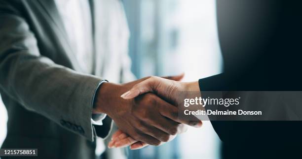 this merger will see the potential growth of our business - business handshake stock pictures, royalty-free photos & images