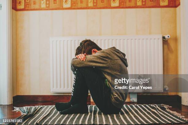 depressed kid during epidemic quarantine - persona irriconoscibile foto e immagini stock