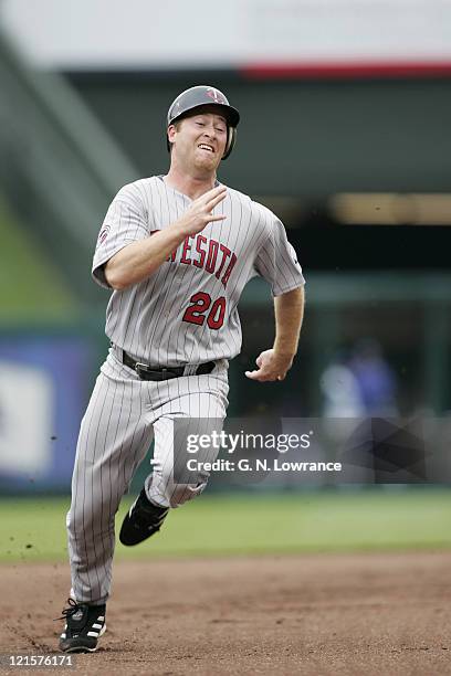 Lew Ford of the Minnesota Twins runs towards third base against the Kansas City Royals on April 28, 2005 at Kauffman Stadium in Kansas City, Mo....