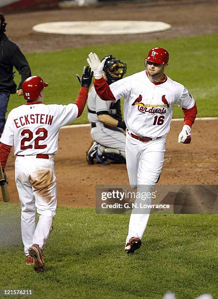 Chris Duncan is congratulated by David Eckstein after hitting a home run in the 6th inning during game 5 action of the NLCS between the New York Mets...