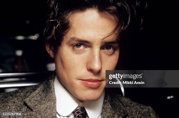Hugh Grant poses while filming 'Maurice,' a film based on the novel by E.M. Forster in London in December 1986
