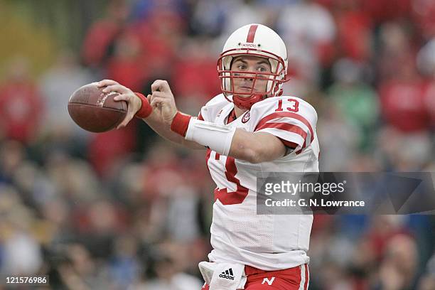 Zac Taylor of the Nebraska Cornhuskers attempts a pass during a game against the Kansas Jayhawks at Memorial Stadium in Lawrence, Kansas on November...