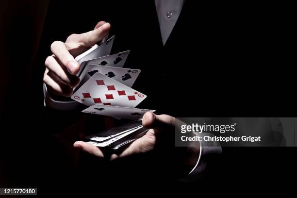 card trick - magician stock pictures, royalty-free photos & images