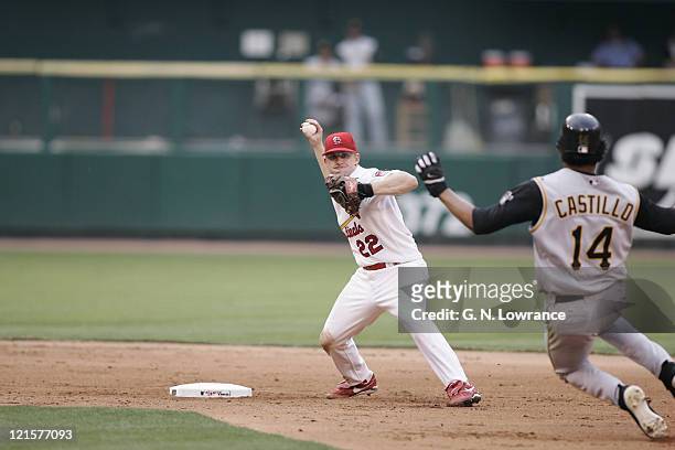 David Eckstein of the St. Louis Cardinals throws to complete a double play during a game against the Pittsburgh Pirates at Busch Stadium in St....