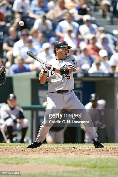 Tadahito Iguchi of the Chicago White Sox is hit by a pitch against the Kansas City Royals at Kauffman Stadium in Kansas City, Mo. On July 27, 2005....