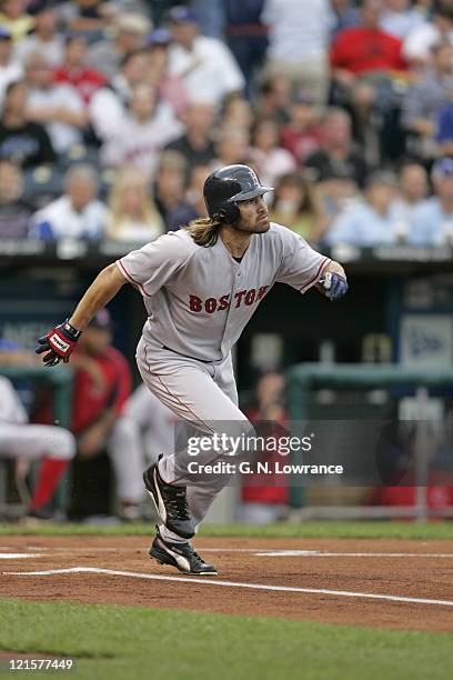 Johnny Damon of the Boston Red Sox gets a single against the Kansas City Royals at Kauffman Stadium in Kansas City, Mo. On August 25, 2005. The...