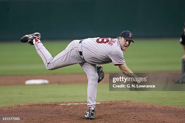 Curt Schilling of the Boston Red Sox throws a pitch against the Kansas City Royals at Kauffman Stadium in Kansas City, Mo. On August 25, 2005. The...