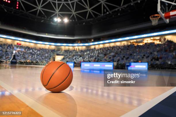 basketball on court - basketball court texture stock pictures, royalty-free photos & images