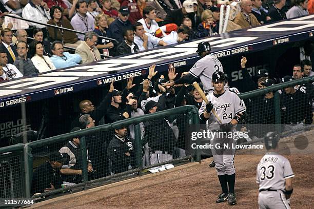 The Chicago White Soxs congratulate Tadahito Iguchi and Jermaine Dye during action in game 3 of the World Series between the Chicago White Sox and...