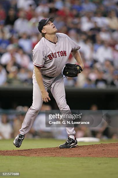 Curt Schilling of the Boston Red Sox watches a batted ball against the Kansas City Royals at Kauffman Stadium in Kansas City, Mo. On August 25, 2005....