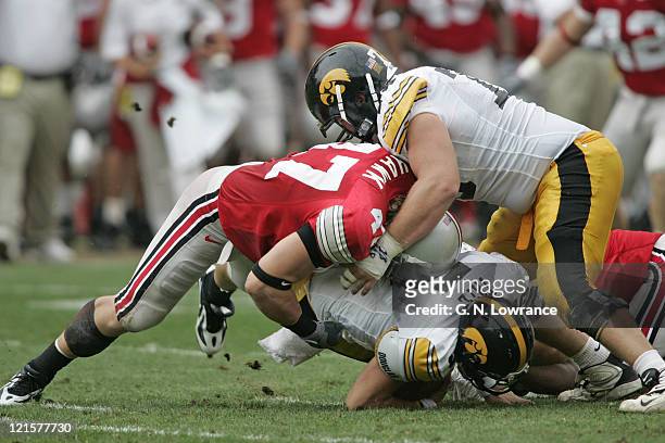 Linebacker A.J. Hawk of the Ohio State Buckeyes buries quarterback Drew Tate of the Iowa Hawkeyes at Ohio Stadium in Columbus, Ohio on Sept. 24,...