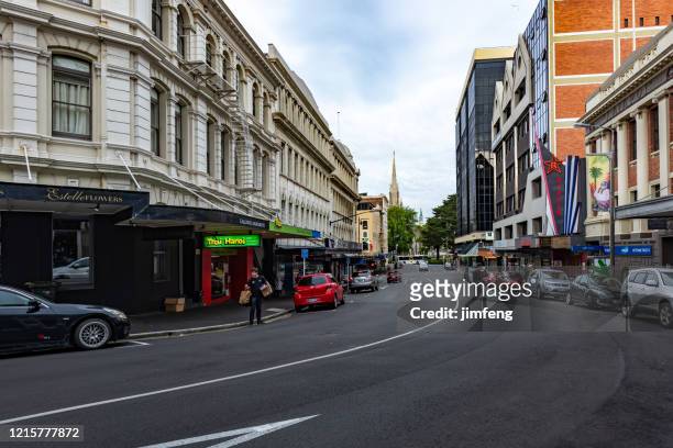 the street view of dunedin city in new zealand - dunedin nz stock pictures, royalty-free photos & images