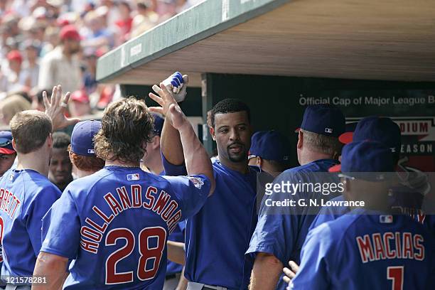 Derrek Lee of the Chicago Cubs is congratulated after hitting a home run during a game against the St. Louis Cardinals at Busch Stadium in St. Louis,...