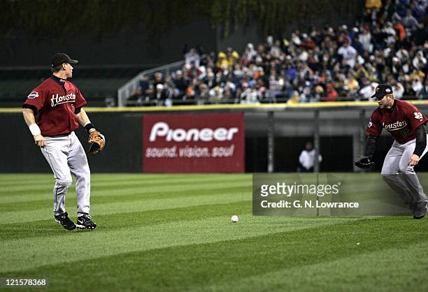 Second baseman Craig Biggio of the Houston Astros misses a fly ball that would score a run on a hit by Juan Uribe during game 2 of the 2005 World...