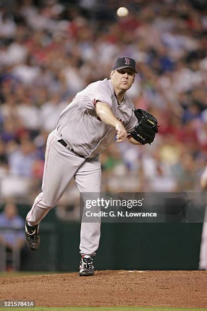 Curt Schilling of the Boston Red Sox throws to first base during a game against the Kansas City Royals at Kauffman Stadium in Kansas City, Mo. On...