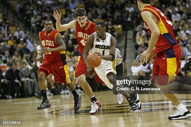 Jimmy McKinney of the Missouri Tigers drives down the lane during 1st half action against the Iowa State Cyclones at Mizzou Arena in Columbia,...